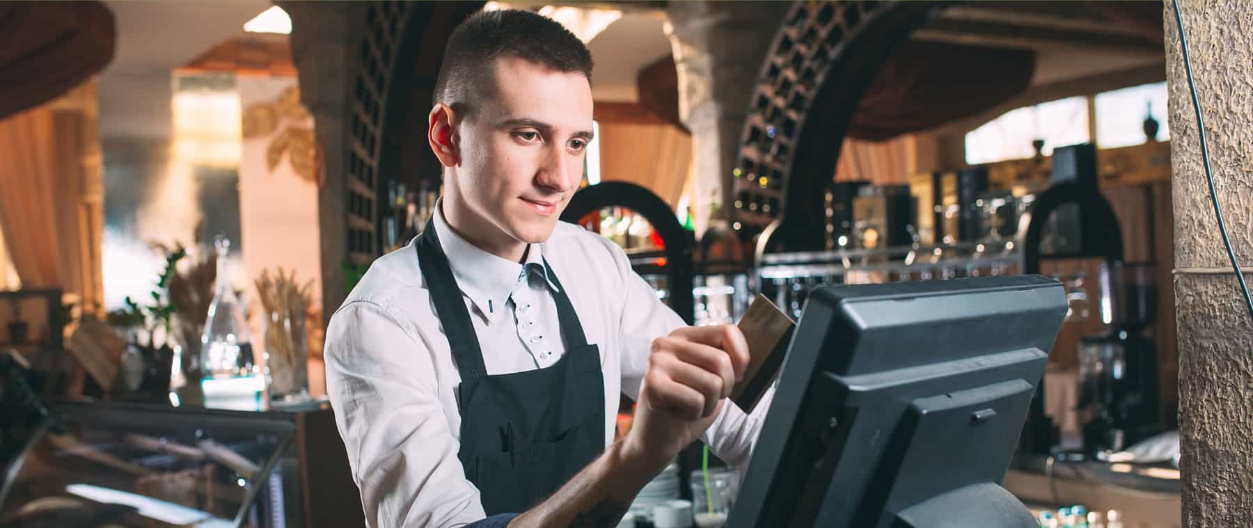 bartender enters order on point of sale with credit card
