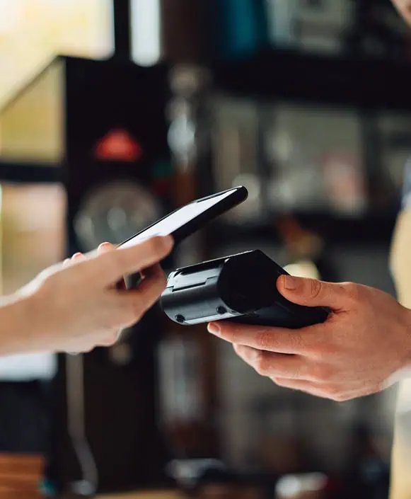 Contactless payment transaction with mobile phone and card reader at Host Merchant Services.