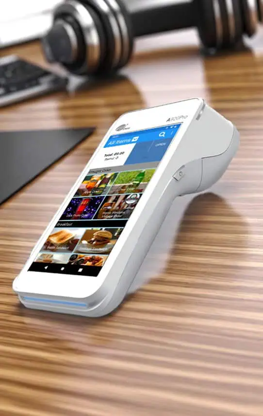 Contactless payment device on wooden table for Host Merchant Services solutions.